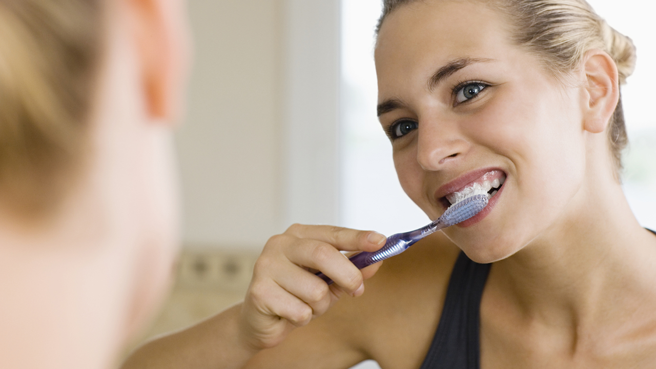 Woman Brushing Teeth